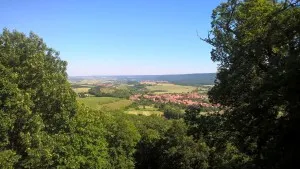 Panoramic view over green valley and village landscape